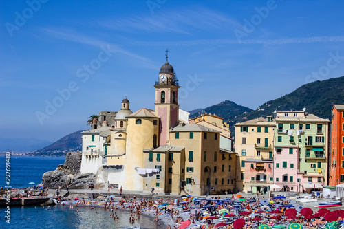 Colorful buildings and beach at Camogli on sunny summer day, Liguria