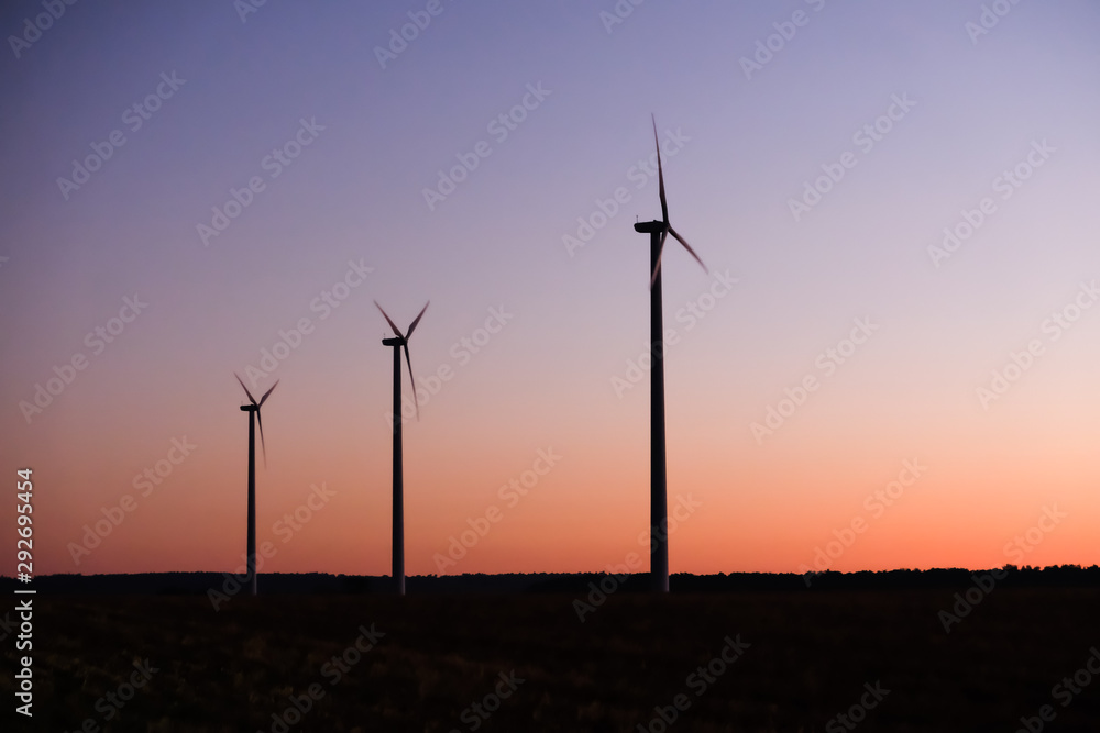 Alternative energy - wind turbines at dusk