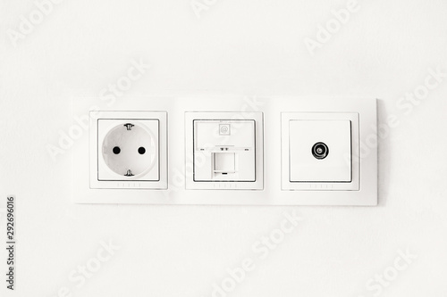 sockets with antenna cable and internet on a white wall