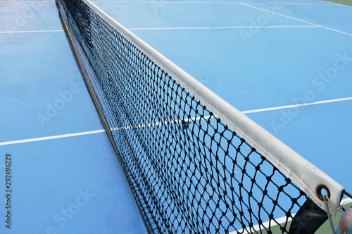 net of tennis court with white border line on blue floor © pedphoto36pm