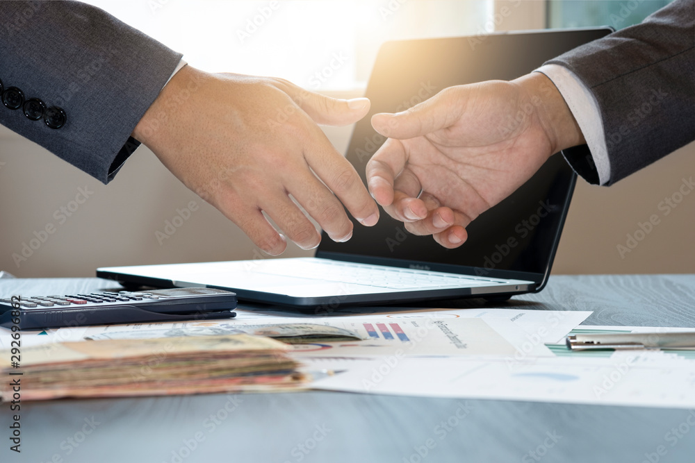 Businessman gesture shaking hand for successful dealing negotiation. They achieve and enjoy with marketing business meeting between supplier and customer. Businessman gesture shaking hand for successful dealing negotiation. They achieve and enjoy with marketing business meeting between supplier and customer.