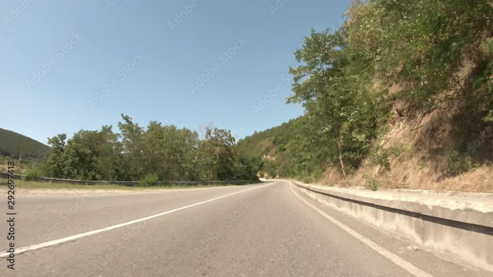 POV, Driving Plate - car driving on a countryside road in Bulgaria on a sunny summer day. POV, Driving Plate - car driving on a countryside road in Bulgaria on a sunny summer day.