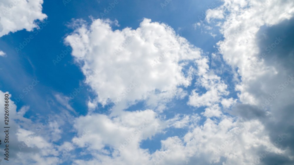 Obraz premium Blue sky background with white clouds.