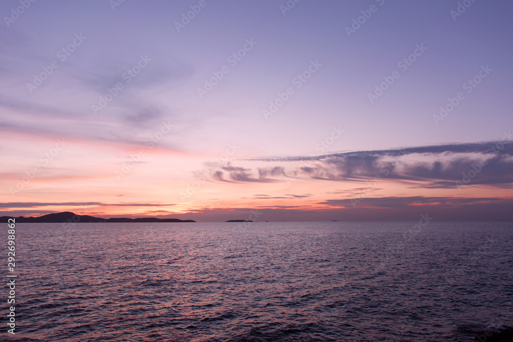 Sea sunset landscape. Pink clouds.