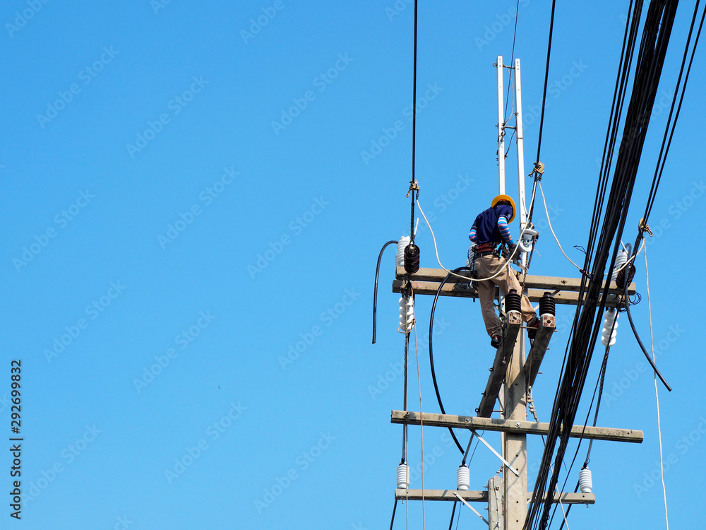 electrician man working at height and dangerous ,high voltage power line maintenance