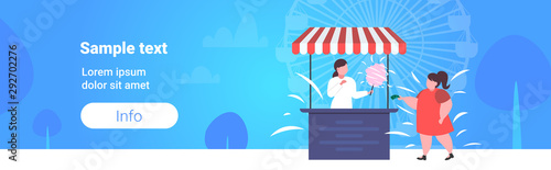 fat obese girl buying ice cream at food stall unhealthy nutrition obesity concept female child having fun public park ferris wheel landscape background full length flat copy space horizontal