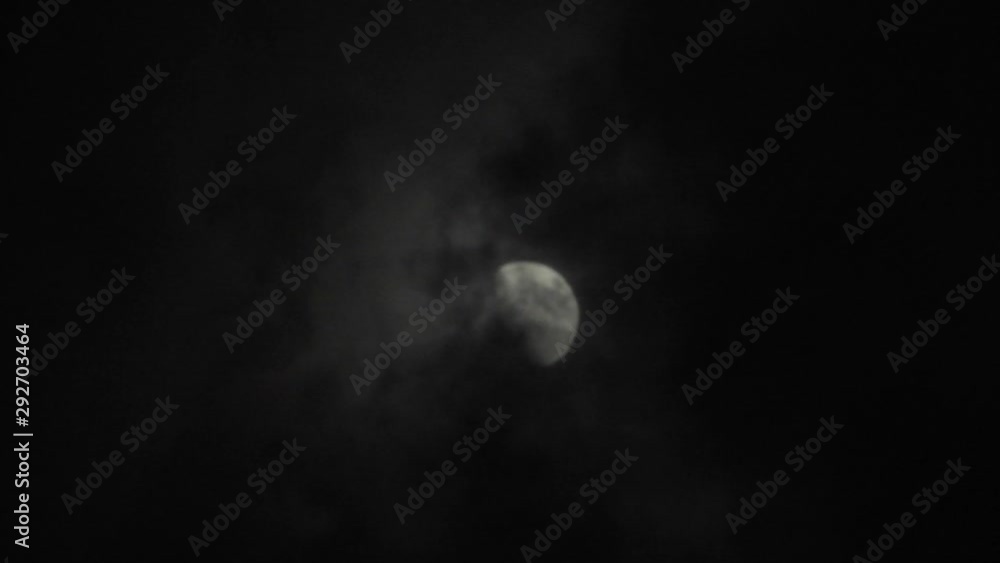 Moon with clouds in the night sky. Cloudy weather on a autumn night. Mysterious night sky with moon. Spooky night and mystery. Dramatic clouds in the moonlight. Moon with clouds in the night sky. Cloudy weather on a autumn night. Mysterious night sky with moon. Spooky night and mystery. Dramatic clouds in the moonlight.