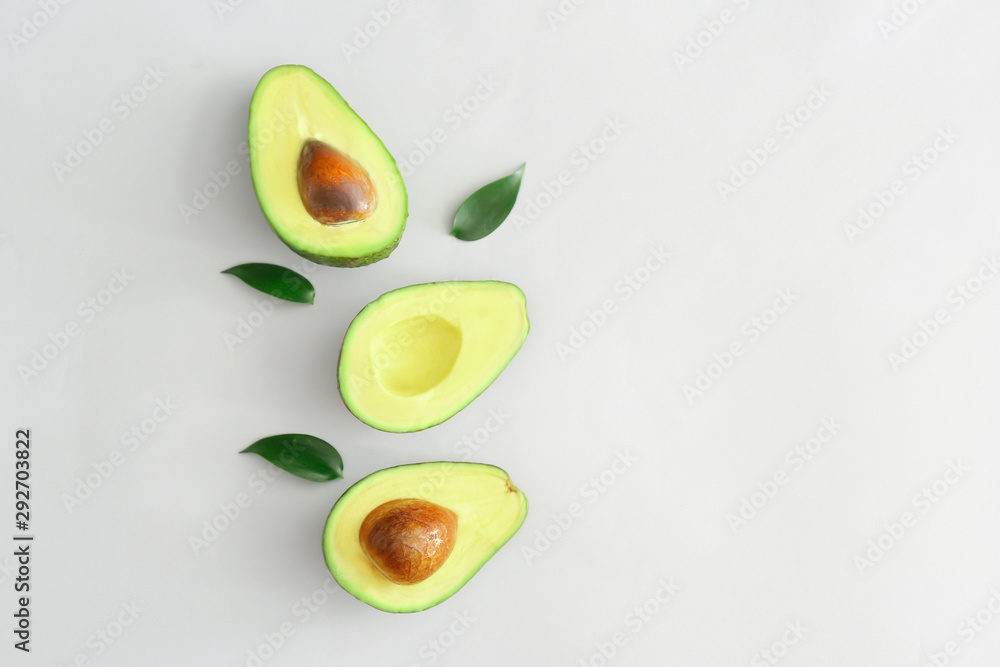 Halves of ripe avocado on white background Halves of ripe avocado on white background