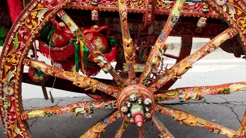 2019.09.22 VIAGRANDE. Sicily. Italy. Grape harvest festival. Famous Sicilian cart, carretto siciliano. Passengers sing and play on different instruments