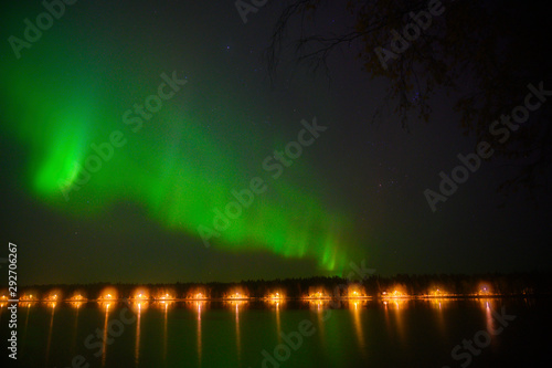 Northern polar light Aurora borealis beautiful light iluminated under the starry dark sky