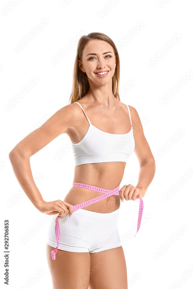 Beautiful young woman with measuring tape on white background. Weight loss concept Beautiful young woman with measuring tape on white background. Weight loss concept