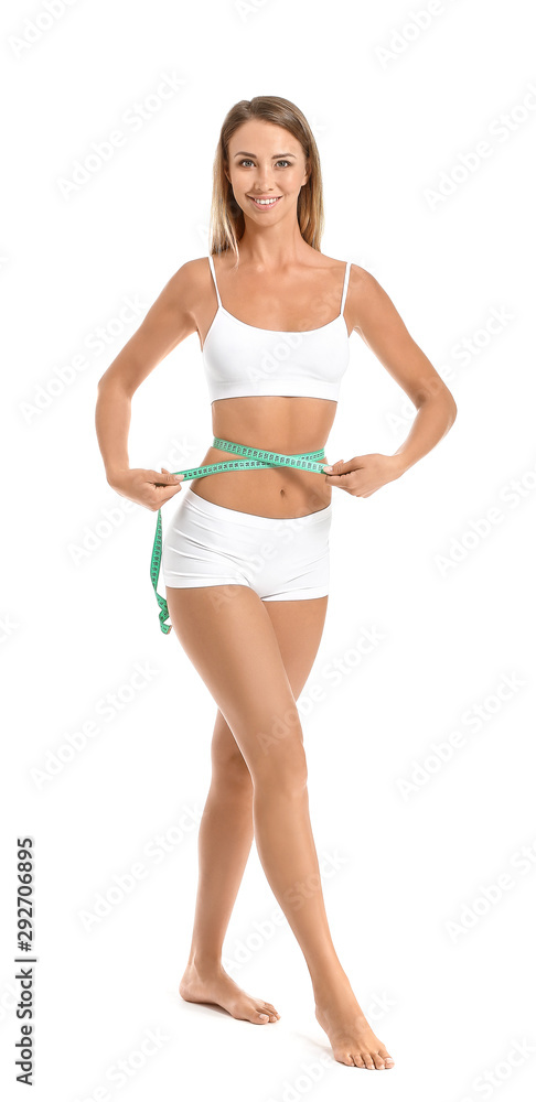 Beautiful young woman with measuring tape on white background. Weight loss concept Beautiful young woman with measuring tape on white background. Weight loss concept