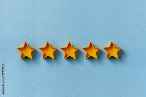 Row of five gold stars for excellence