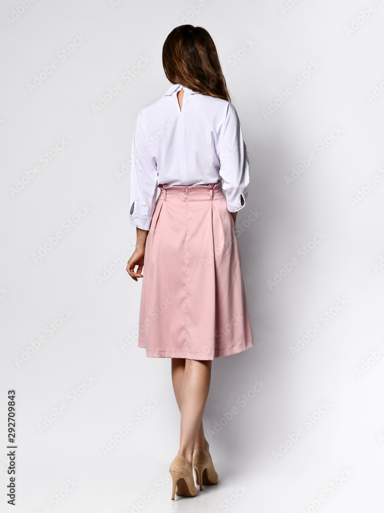 A successful young businesswoman, isolated on white background A successful young businesswoman, isolated on white background