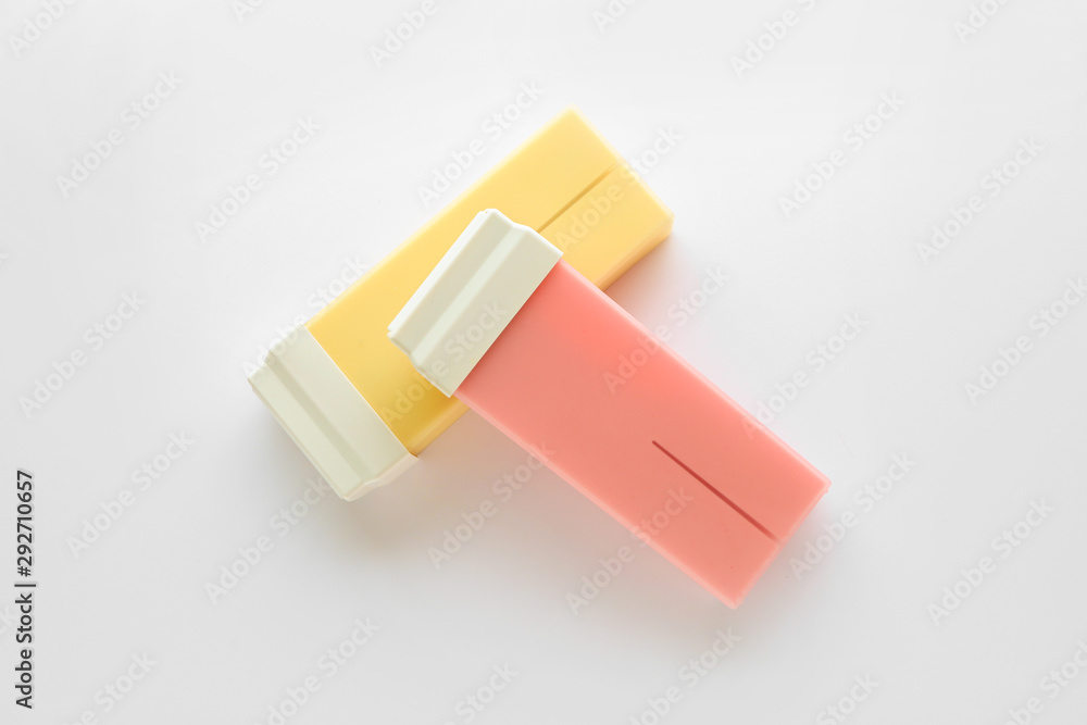 Liposoluble wax cartridges on white background Liposoluble wax cartridges on white background
