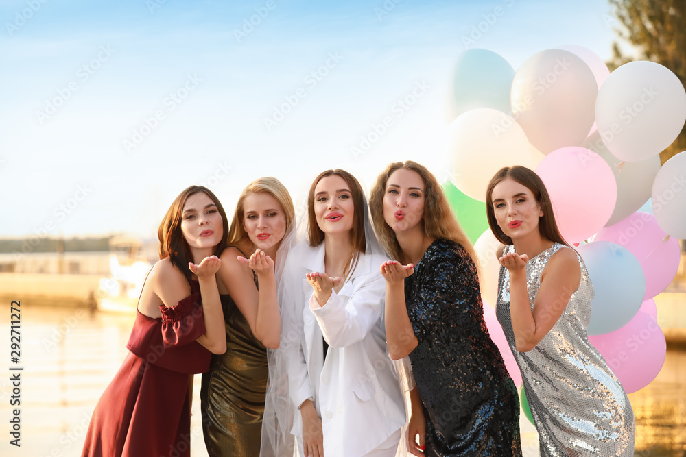 Beautiful young women at hen party near river Beautiful young women at hen party near river