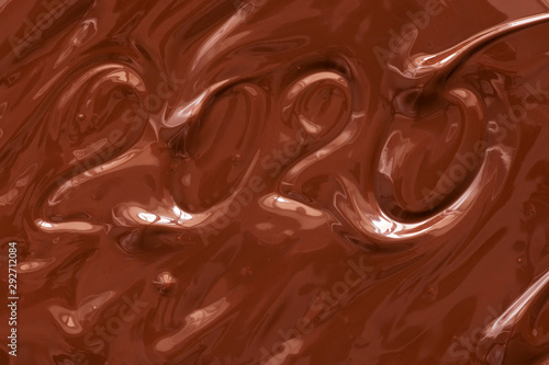 Texture liquid chocolate 2020 new year. Melted Chocolate Background