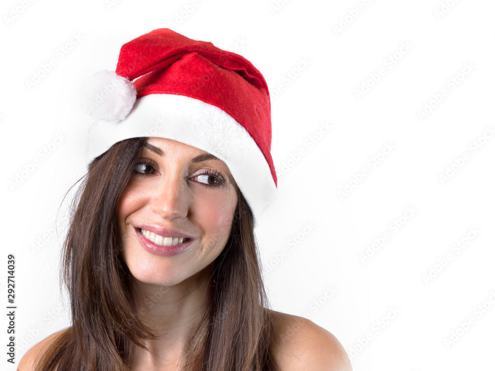 Smiling woman in Santa Claus hat looking towards white background Smiling woman in Santa Claus hat looking towards white background