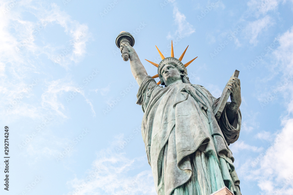 Fototapeta premium The famous statue of Liberty on an island in Paris