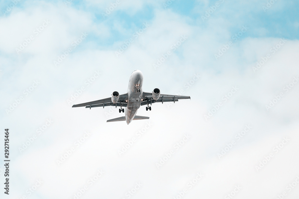 White Airplane landing, bottom view White Airplane landing, bottom view