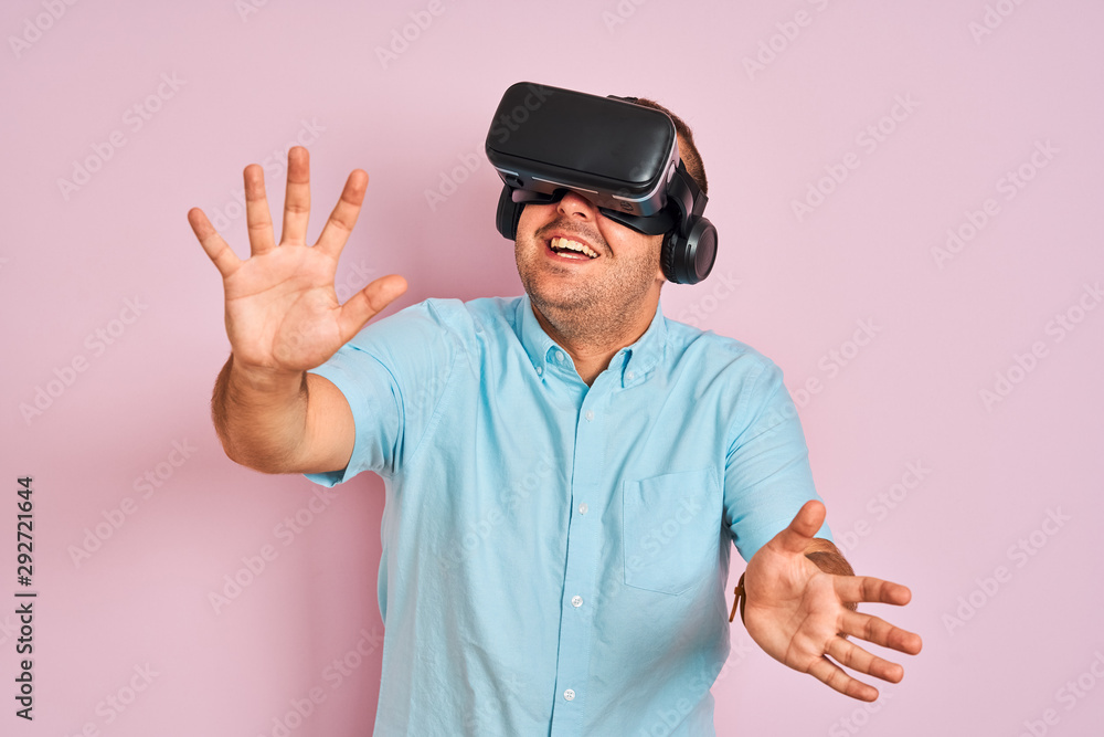 Young plus size man playing virtual reality game using goggles Young plus size man playing virtual reality game using goggles