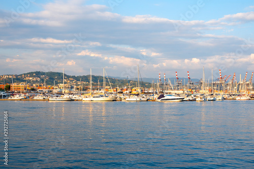 Pier with boats, blue sea and sky