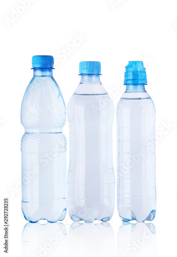 three full plastic bottles with mineral water