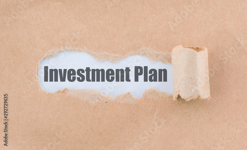 Letter Investment Plan Written Behind the Torn Paper
