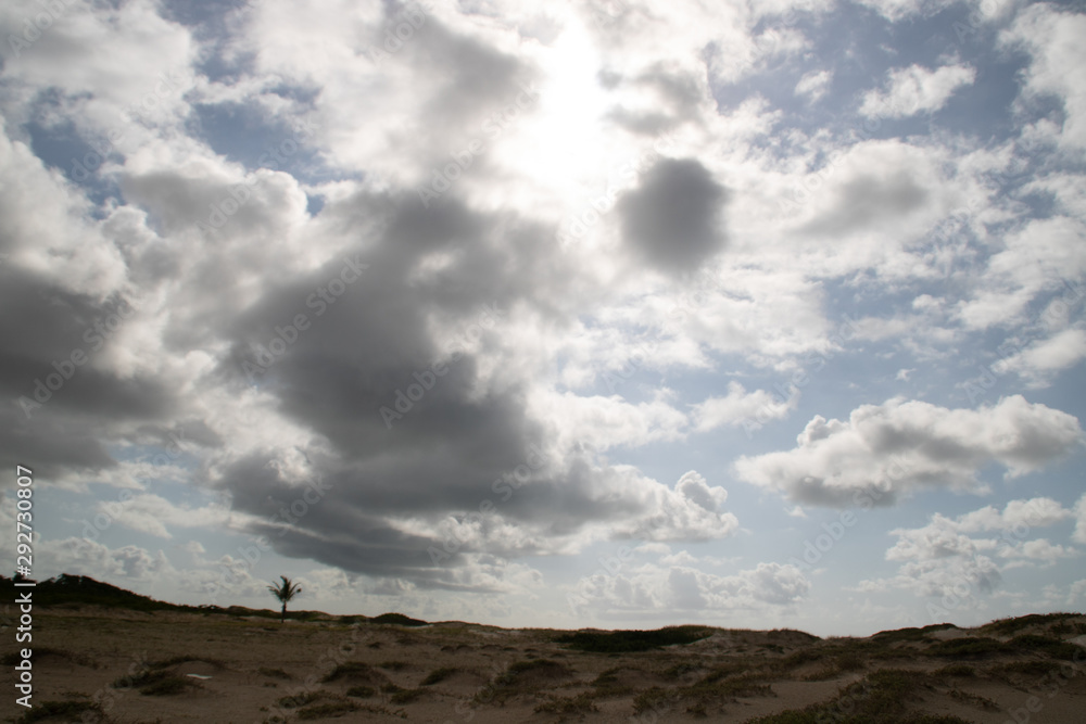 clouds over dunes