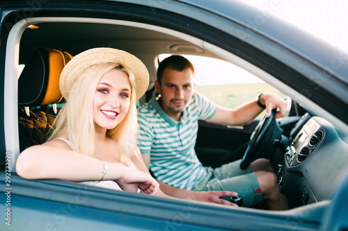 Enjoying road trip together. Happy young couple having fun while riding in their car. © F8  \ Suport Ukraine
