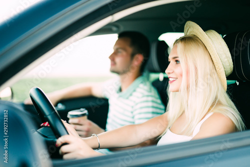 Leisure, road trip, travel, family and people concept, Happy man and woman driving in car © F8  \ Suport Ukraine