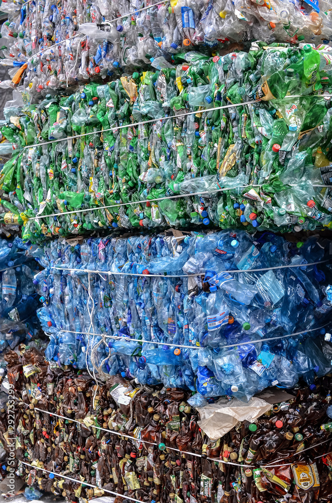 Fototapeta Green plastic PET bottles pressed in bales for recycling