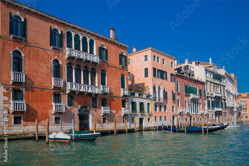 View of Venice from the Grand Canal. Venetian old colorful buildings against blue sky. Boat trip through the canals of Venice. © Adamchuk