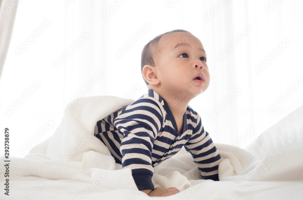 cute asian seven month baby in white dress smiling cute asian seven month baby in white dress smiling