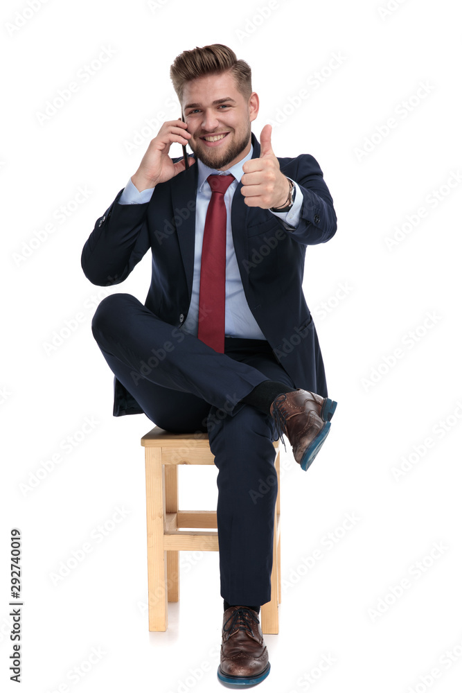 happy young businessman talking on the phone happy young businessman talking on the phone