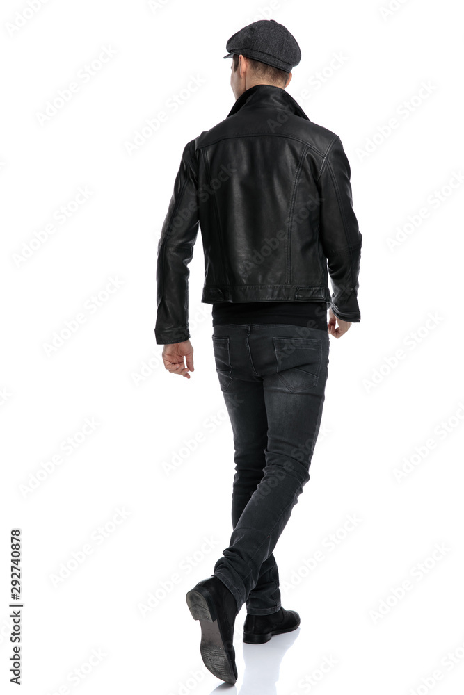 casual man walking one way and looking the other casual man walking one way and looking the other