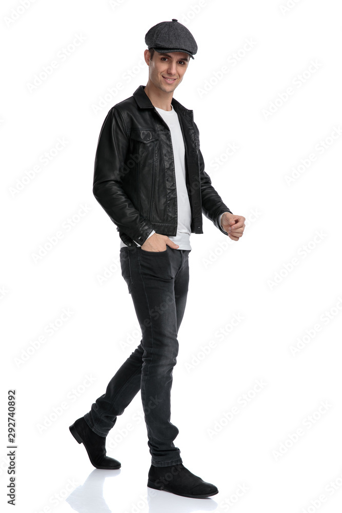 casual man walking with hand in pocket happy casual man walking with hand in pocket happy