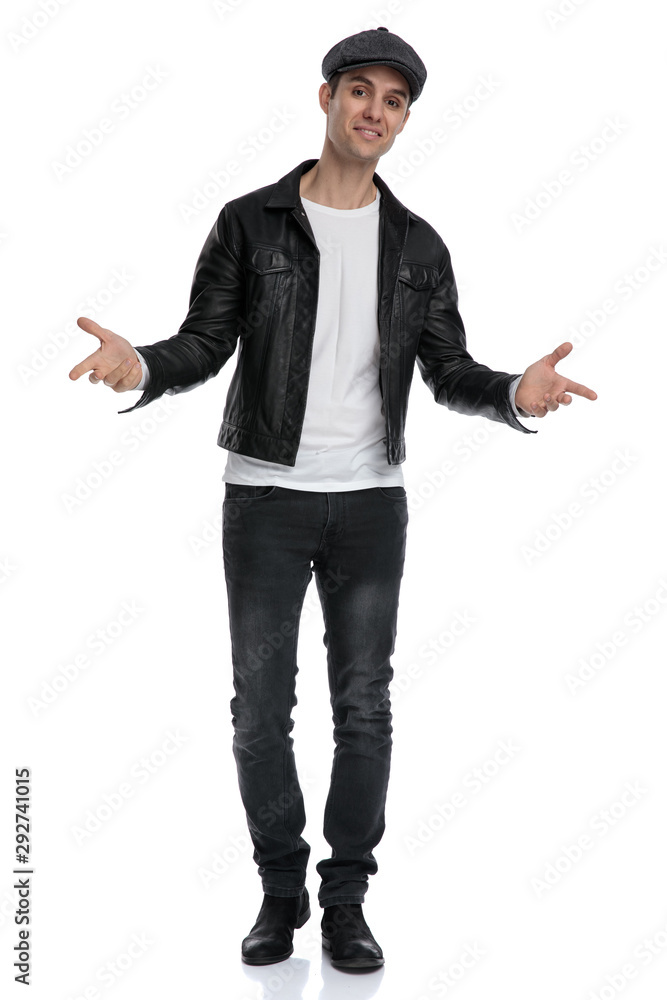 casual man standing with open arms cocky casual man standing with open arms cocky