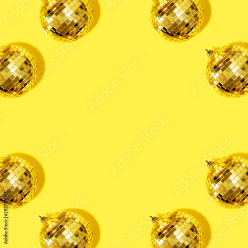 Premium Photo  New year baubles shiny gold disco balls on blue background  pop disco style attributes retro concept creative christmas pattern flat  lay top view