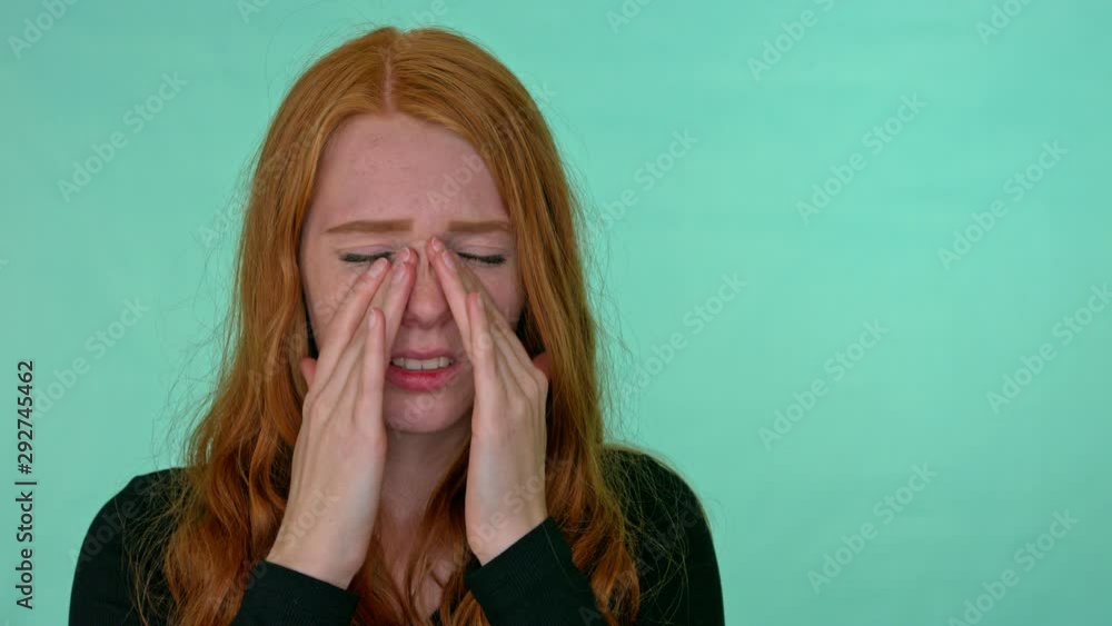 Portrait of woman with season allergy, allergic rhinitis or flu symptoms. Shot in studio on green screen. Portrait of woman with season allergy, allergic rhinitis or flu symptoms. Shot in studio on green screen.