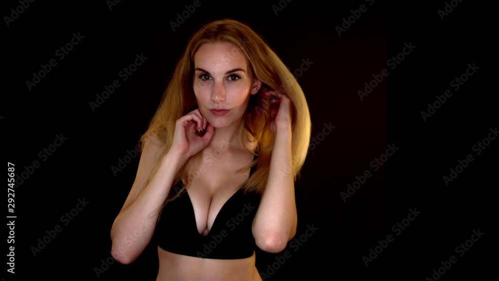Sensual woman in black bra playing with her hair, Slow motion Sensual woman in black bra playing with her hair, Slow motion
