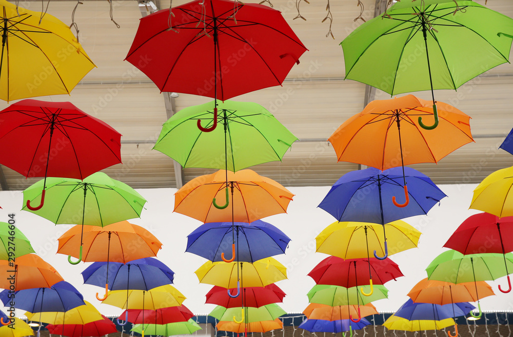 seamless pattern with umbrellas. Abstract background with red, yellow, green, blue, orange umbrellas..
