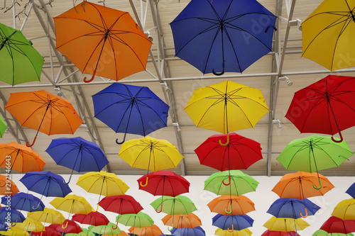 colorful umbrellas on a background. Abstract background with red  yellow  green  blue  orange umbrellas..