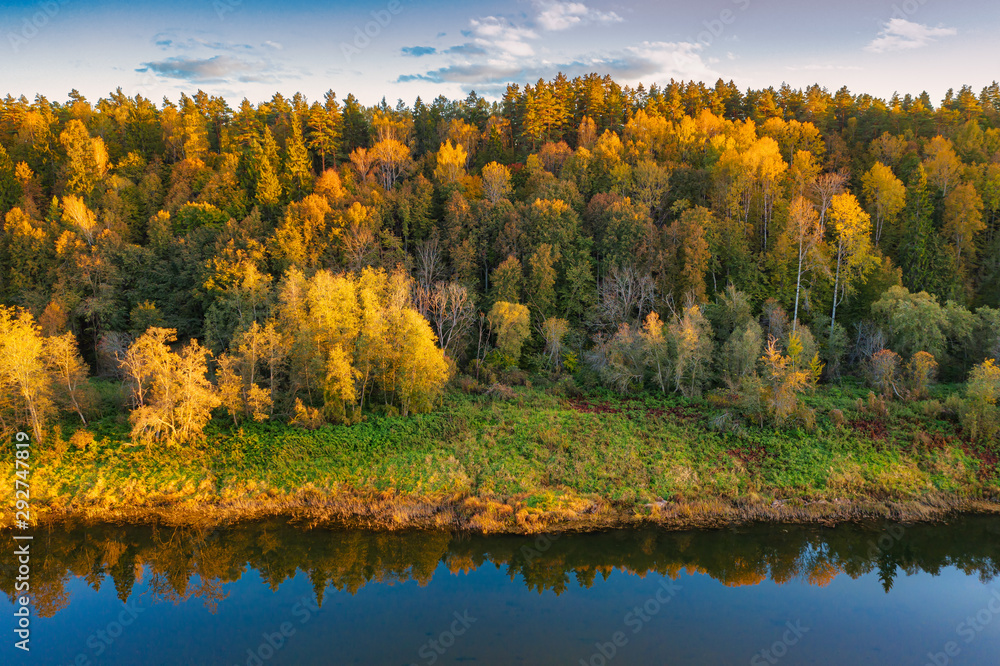 Autumn landscape. Forest and river. Aerial view.