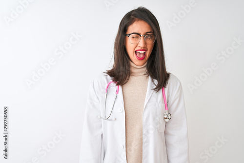 Chinese doctor woman wearing coat and pink stethoscope over isolated white background winking looking at the camera with sexy expression  cheerful and happy face.