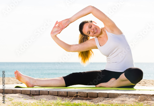 Woman doing yoga sitting