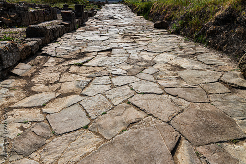 Ancient Roman road. Street in the Roman ruins of Baelo Claudia, located near Tarifa. Andalucia. Spain.