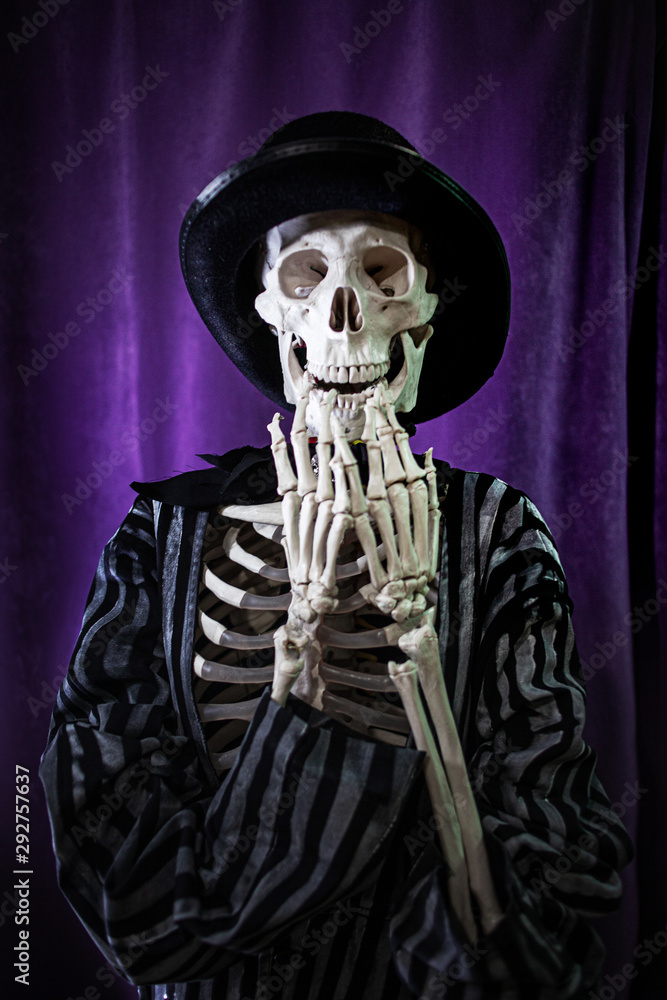 shocked skeleton in a striped suit and top hat. Halloween shocked skeleton in a striped suit and top hat. Halloween