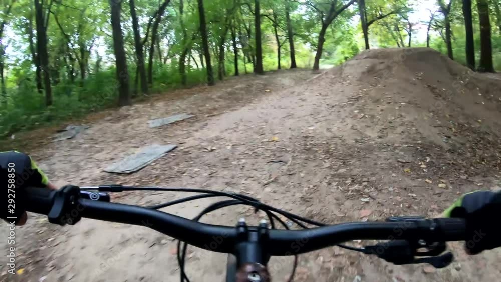 Amateur rider on the MTB bicycle on the trails in the autumn season Amateur rider on the MTB bicycle on the trails in the autumn season
