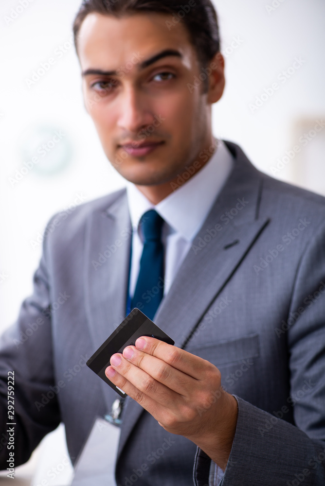 Young male accountant working in the office Young male accountant working in the office